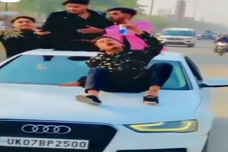 stunt-of-nobles-youths-riding-on-roof-of-audi-car-did-stunts-openly-spilled-jam