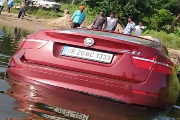 Depressed man sinks BMW car in Cauvery river at karnataka