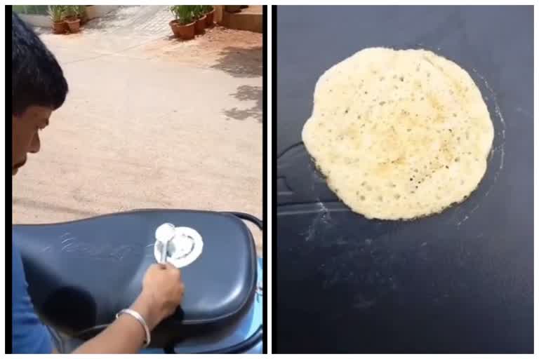 Man cooks dosa on scooter