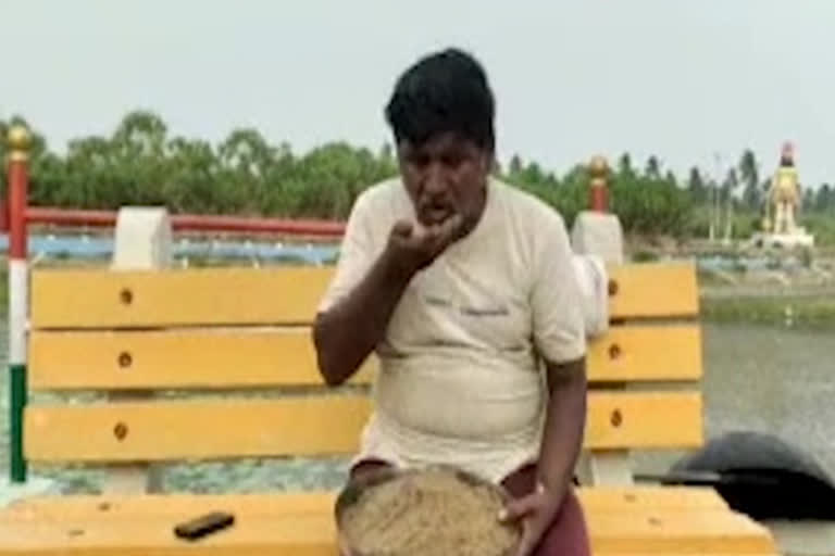 Man eating sand