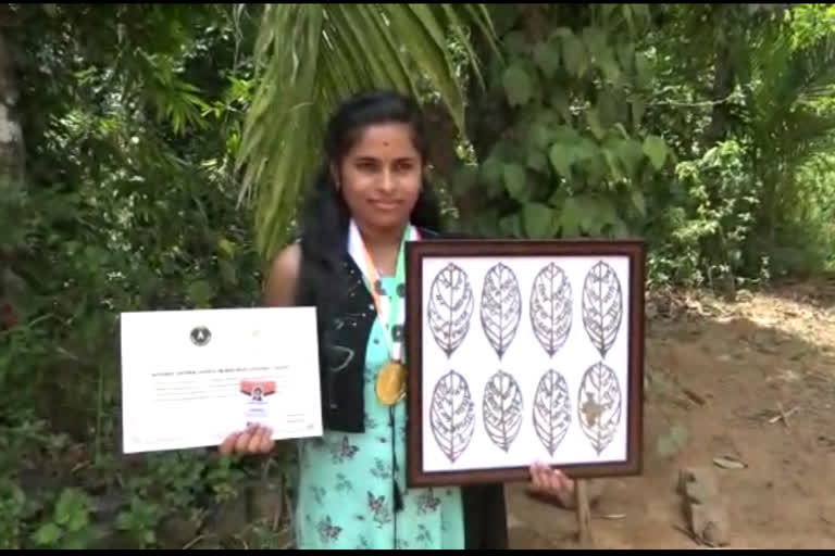 Young woman carves National Anthem on leaf, makes 'India Book of Record'