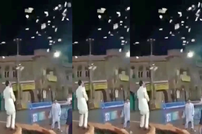 Man throws Currency Into the air