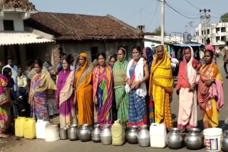 womans blocked the road for water