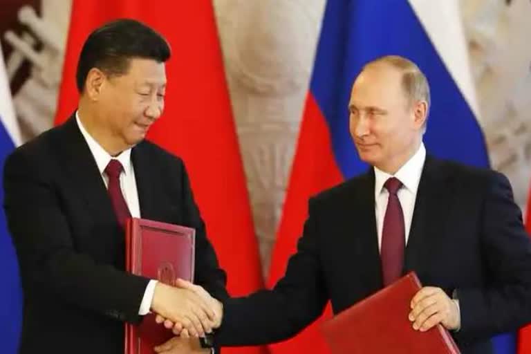 Chinese President President Xi holds a phone conversation with Russian President Putin on Wednesday