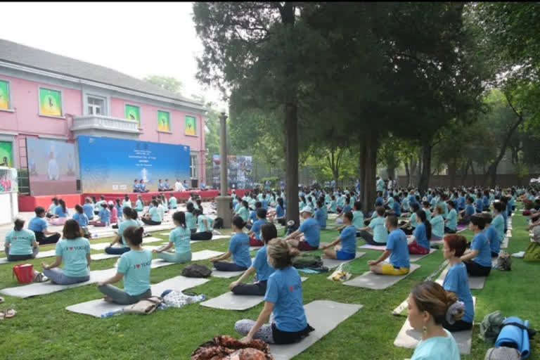 Large number of Chinese yoga enthusiasts throng Indian Embassy's IYD event