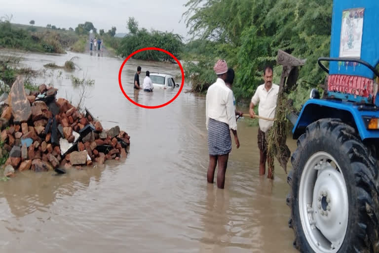 car struck in rain water at ananthapur