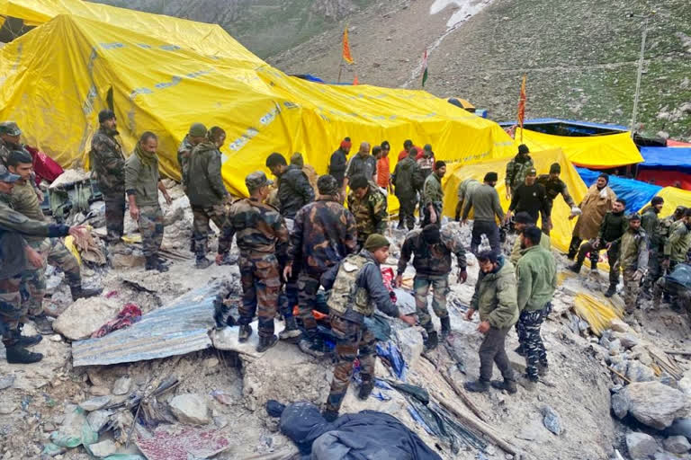 At least 15 persons have been killed as flash floods triggered by a cloudburst near the Amarnath shrine, which also ravaged the base camp destroying 25 tents and 3 community kitchens, on Friday evening.