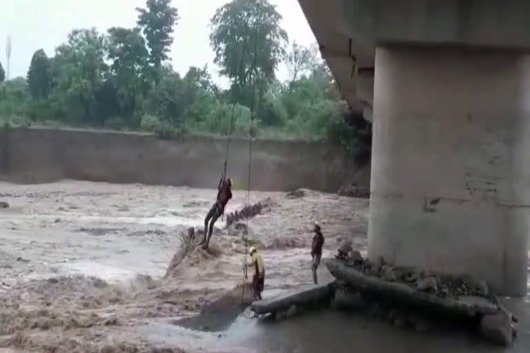 Police rescued two youths trapped on the island of Kotdwar Sukhro river