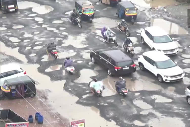 National Highway-48 covered in potholes filled with water