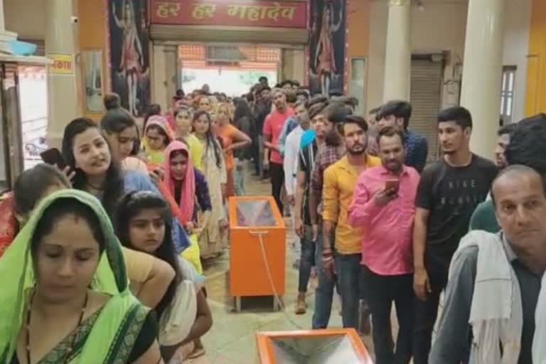 Crowd of devotees gathered in ancient Harni Mahadev temple