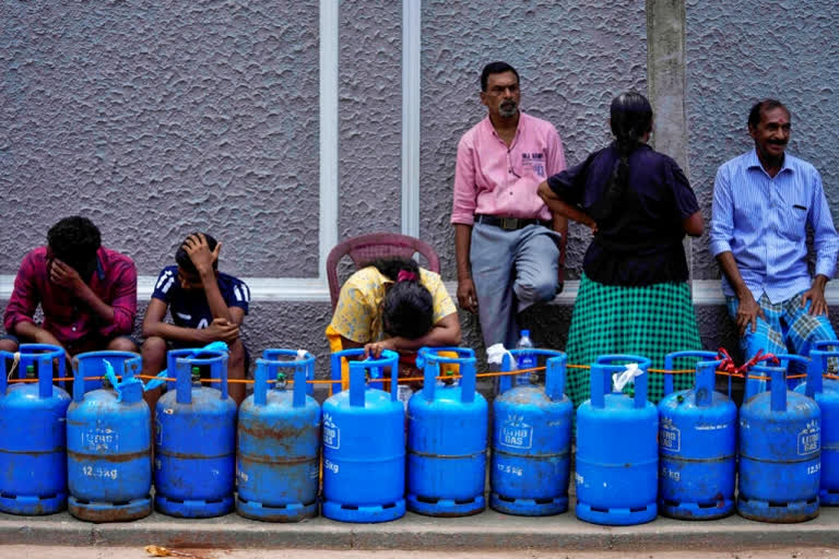 People wait in queue for about a week to get a refill cooking gas cylinder in the Island nation. As inflation shoots through the roof in the economic crisis ridden Sri Lanka, daily life is a struggle in itself, writes ETV Bharat's Suparna Das.