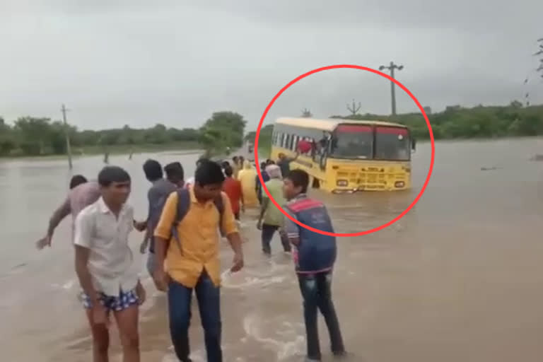 School Bus Stuck in Flood with kids at kommulavancha