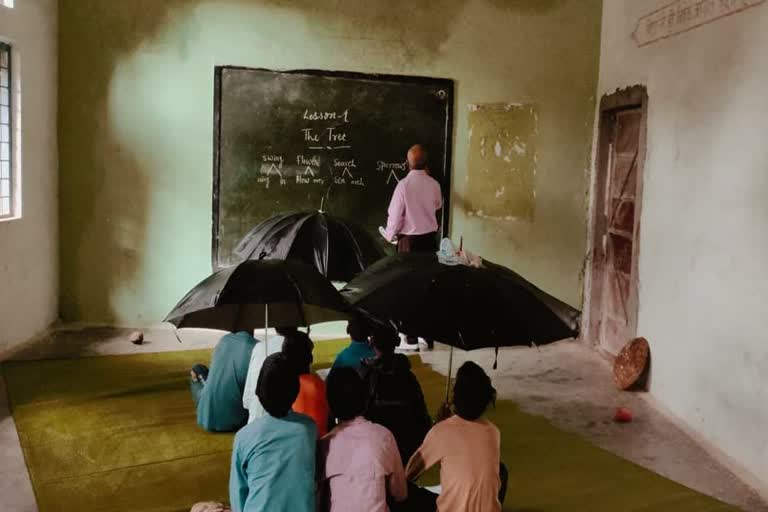 Student using umbrella in Class Room