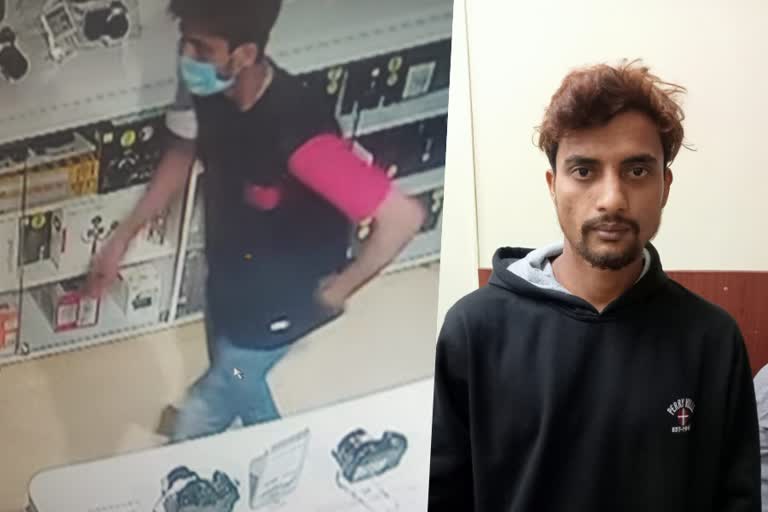 man stolen expensive mobile phones Bengaluru  Man hides in washroom of showroom overnight and stolen mobile phone  man stolen expensive mobile phones for his girlfriend  ലക്ഷങ്ങള്‍ വിലമതിക്കുന്ന മൊബൈല്‍ ഫോണുകള്‍ മോഷ്‌ടിച്ചതിന് യുവാവ് പിടിയില്‍  ബെംഗളൂരുവില്‍ മൊബൈല്‍ മോഷണം  മോഷണം നടത്തിയത് കാമുകിക്ക് സമ്മാനിക്കാന്‍