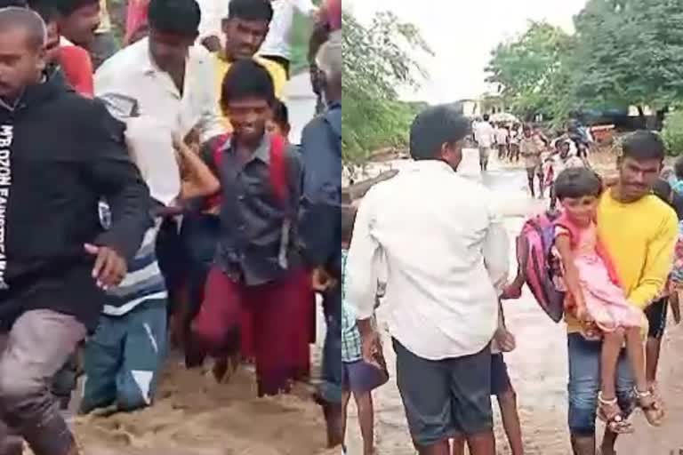 Heavy rain in Kalaburagi  villagers rescued 200 School children and staff  വിദ്യാര്‍ഥികളെ നാട്ടുകാര്‍ മറുകരയിലെത്തിക്കുന്നു  കനത്ത മഴയില്‍ തോട് നിറഞ്ഞു  കനത്ത മഴയില്‍ വീട്ടിലേക്ക് മടങ്ങാനാവാതെ അധ്യാപകരും വിദ്യാര്‍ഥികളും  നാട്ടുകാരുടെ രക്ഷാപ്രവര്‍ത്തനം  ബെംഗളൂരു  കര്‍ണാടകയില്‍ മഴ  Heavy rain in Kalaburagi  Heavy Rains  പുതിയ വാര്‍ത്തകള്‍  മഴ വാര്‍ത്തകള്‍  rain news  rain news in india