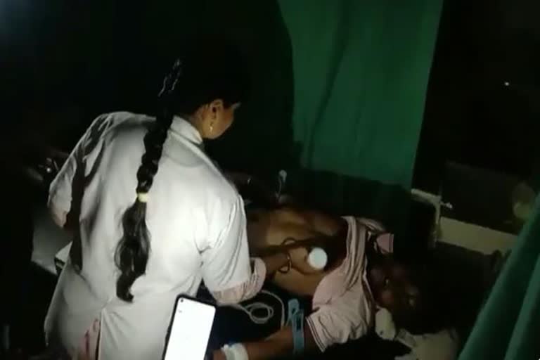 patient treatment under mobile torch light