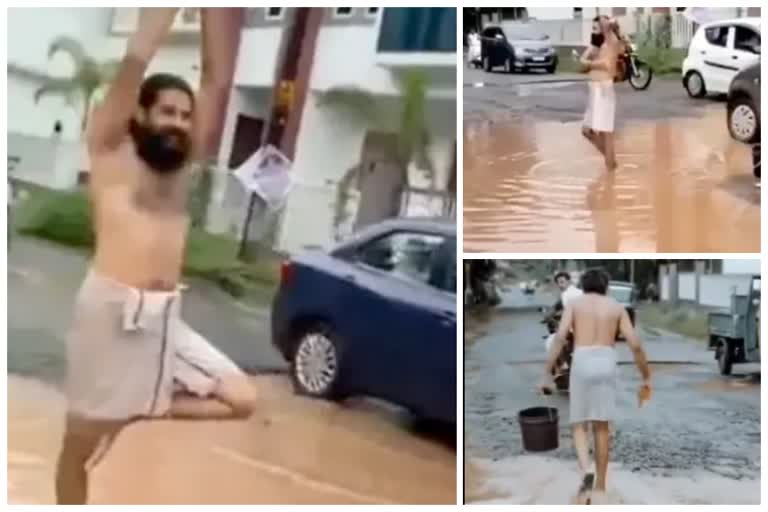 Man Bathes In Pothole to protest