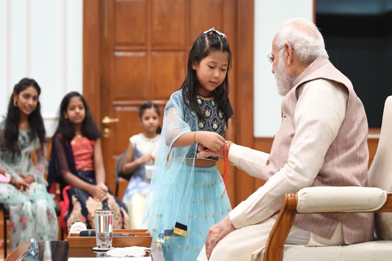 pm tied rakhi pmo employees daughters