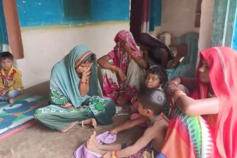 Grieving family members of the deceased child