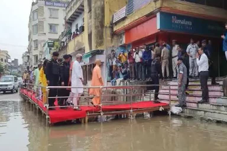 opposition target cm yogi for red carpet welcome in varanasi floods