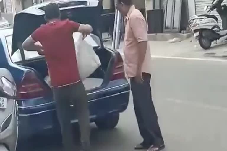 Man picks up wheat and cheap ration in a mercedes