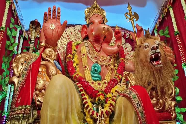 Ganesha idol adorned with  gold ornaments