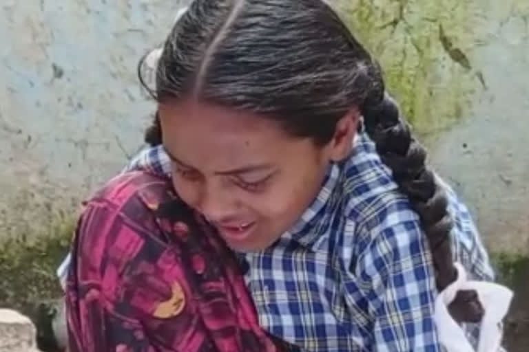 Video of Girl Crying After Losing books over flood in house