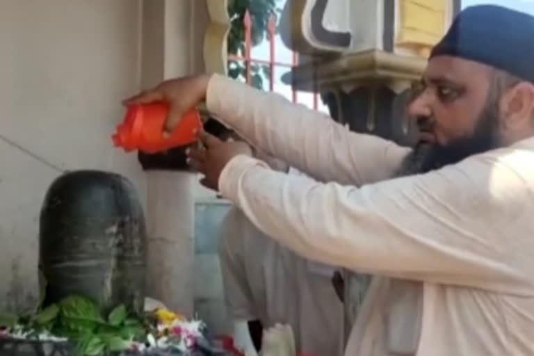 A Muslim worshiped Lord Shiva while performing Jalabhishek in the Shiva temple in Saharanpur.