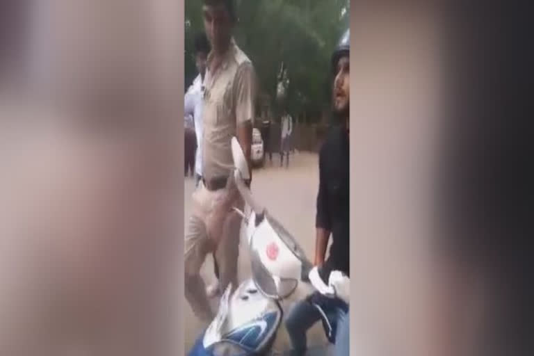 police and scooty rider Argument in Narnaul