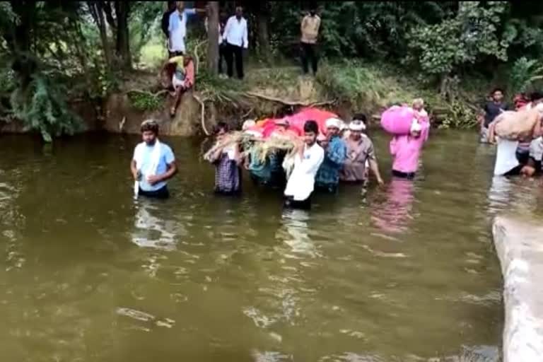 funeral procession through water in Bhilwara