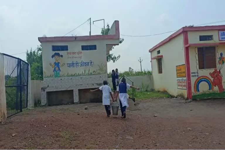 School girls cleaning toilets in Guna