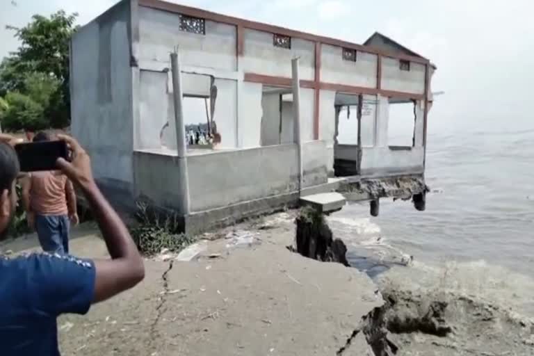 A house washed away in Beki River floods in Kalgachia