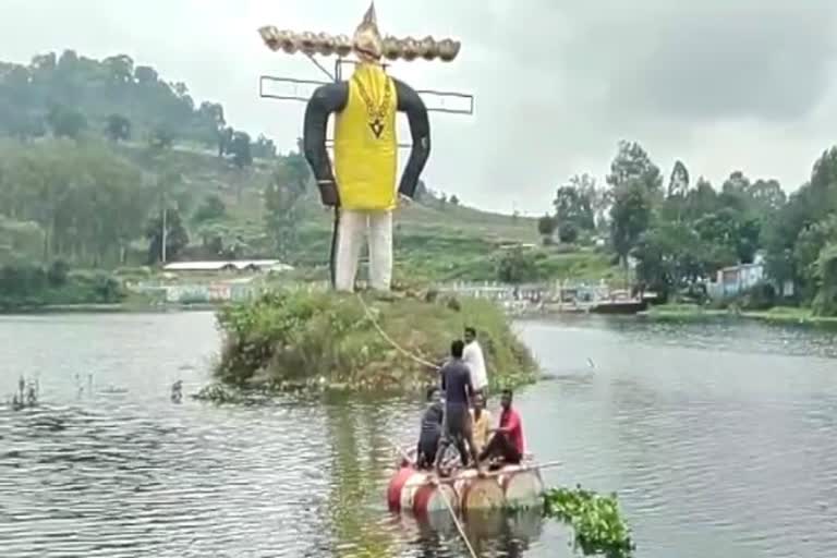 ravan statue on the island of reservoir in koriya kalri