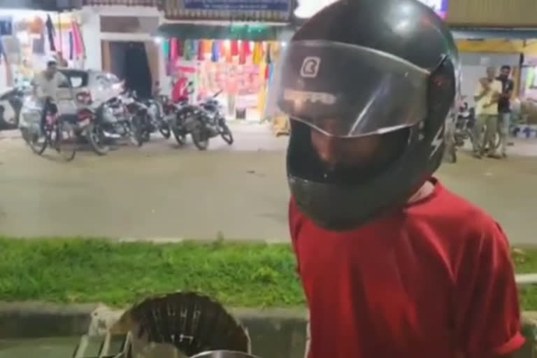 Vegetable seller in helmet