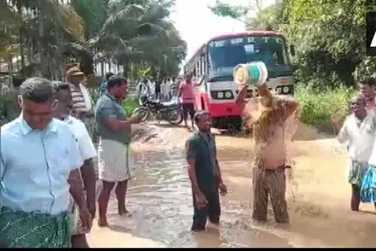 Karnataka Locals in Tumkur take bath in slush protesting over bad roads