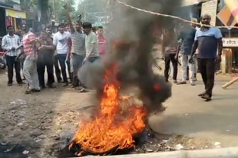 Protest burning tyres demanding road construction in Purba Medinipur