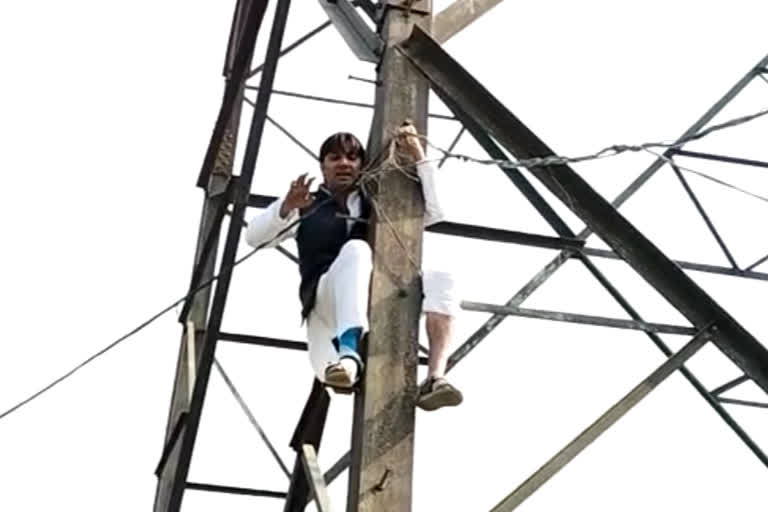 AAP leader climbs atop transmission tower in protest