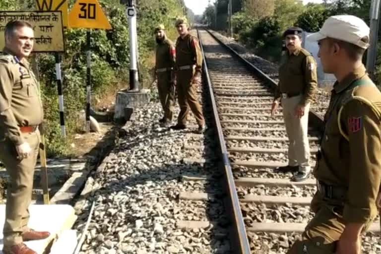 children jump from railway bridge