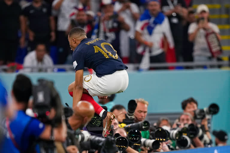 Kylian Mbappe scored two goals and put defending champion France into the knockout stage of the World Cup with a 2-1 win over Denmark on Saturday.