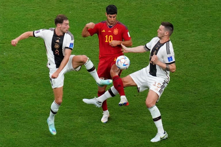 Germany salvages draw with Spain at World Cup