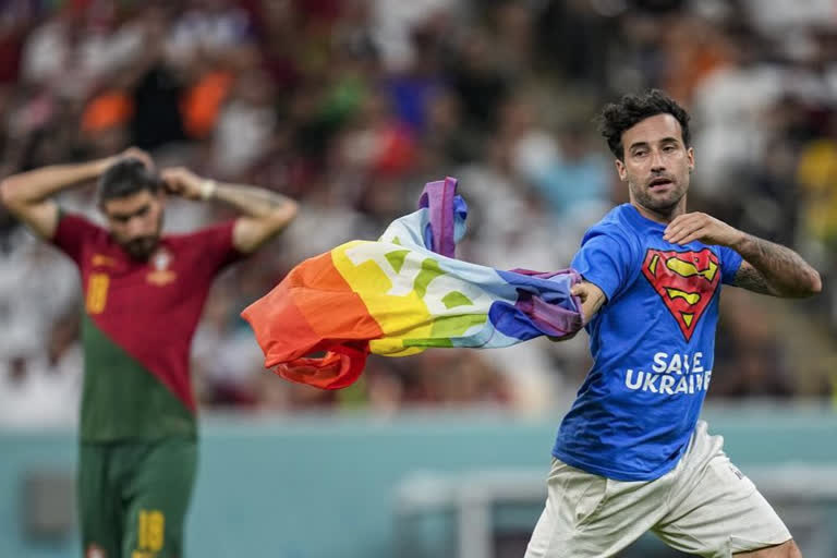 Protester with rainbow flag