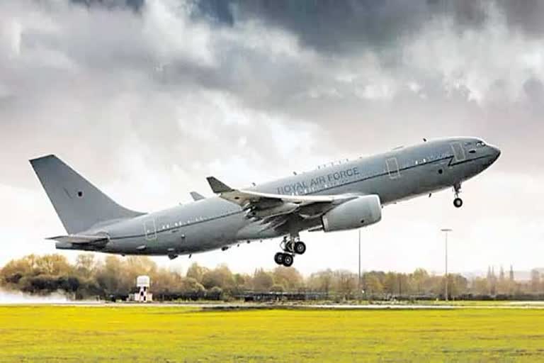 An airplane flying in the sky with cooking oil in Britain's Royal Air Force