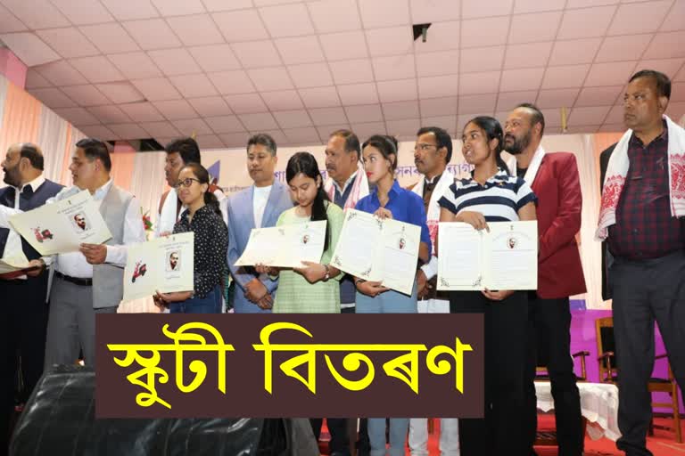 Minister Pijush Hazarika distributes scooty among students