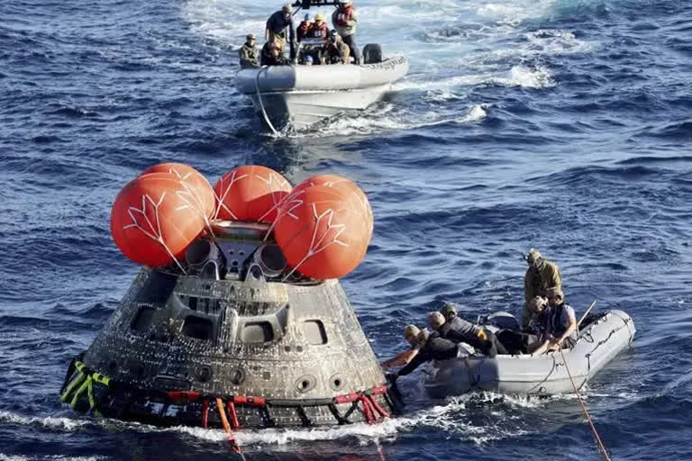 NASA Orion capsule safely blazes back from moon, aces test