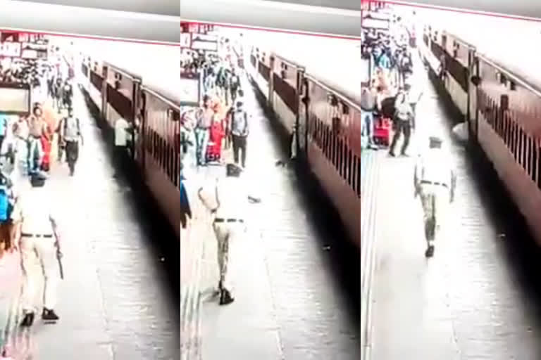 video young man fell between the train platform  man fell between the train platform  ട്രെയിനിൽ കയറുന്നതിനിടെ കാൽ വഴുതി വീണു  സൂറത്ത് റെയിൽവേ സ്റ്റേഷൻ  ഓടുന്ന ട്രെയിനിൽ ചാടിക്കയറാൻ ശ്രമം  സൂറത്ത് റെയിൽവേ സ്റ്റേഷൻ  സൂറത്ത് റെയിൽവേ സ്റ്റേഷൻ