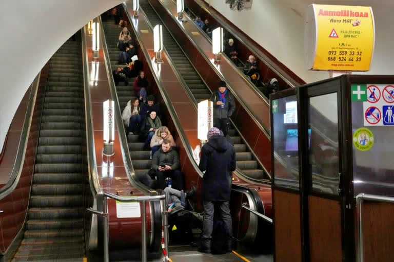 People rest in the subway station being used as a bomb shelter during a rocket attack in Kyiv, Ukraine, Thursday, Dec. 29, 2022. (AP Photo/Efrem Lukatsky)