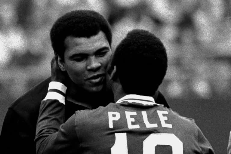 Soccer player Pele embraces boxer Muhammad Ali during a ceremony honoring the Brazilian soccer star of the New York Cosmos at Giants Stadium, East Rutherford, N.J., Oct. 1, 1977.