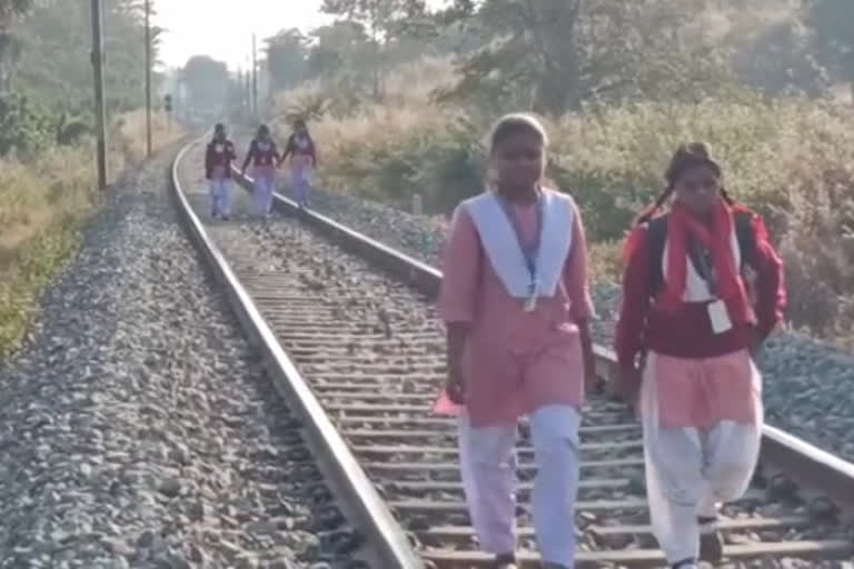 Girls Go To School By Walking On Railway Track