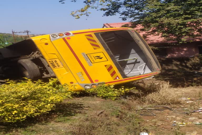 school bus overturns