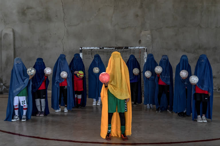 Girls posed for an AP photographer for portraits with the sports equipment they loved by hiding their identities in fear of attracting Taliban harshness.